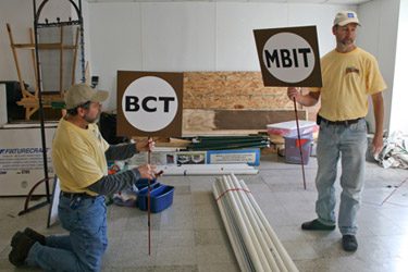 Signage crew at work - photo by Pat Glushko