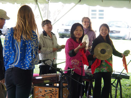 Members of the Melody of China ensemble conduct a Chinese music workshop at Lotus in the Park; photo by Kevin Atkins.